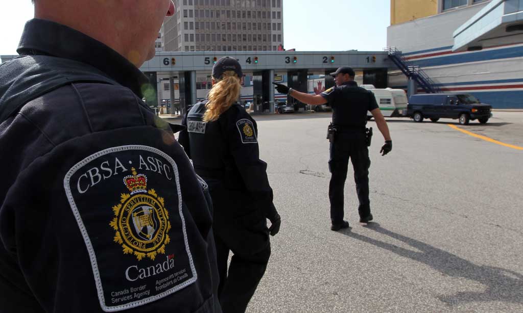 Canada Border Services Agency officers at a border crossing