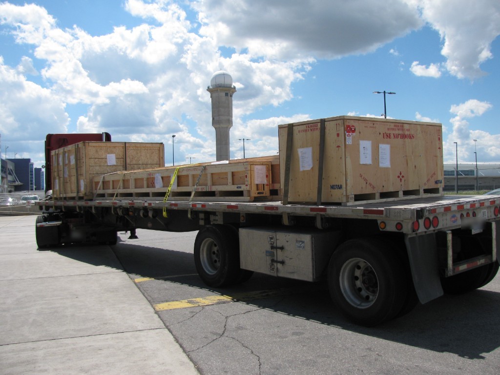 Flatbed truck carrying freight on a Canadian highway